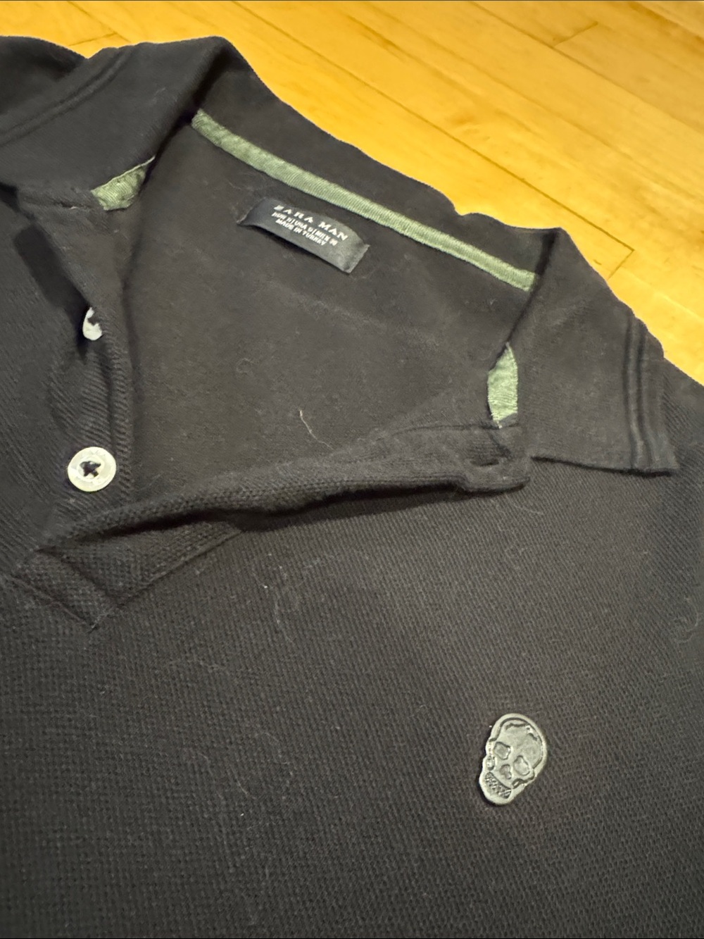 Zara Black Polo with Grey Skull Patch and Green Trim